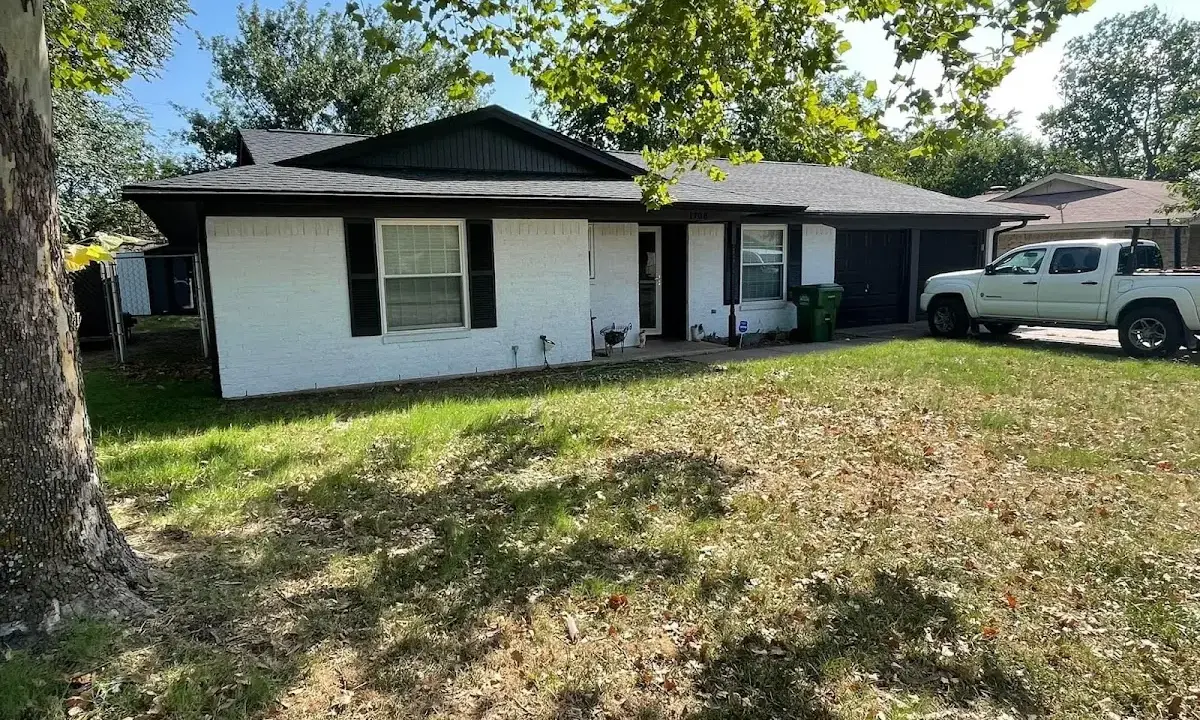 Professional roofing crew working on a residential roof in Ellensburg